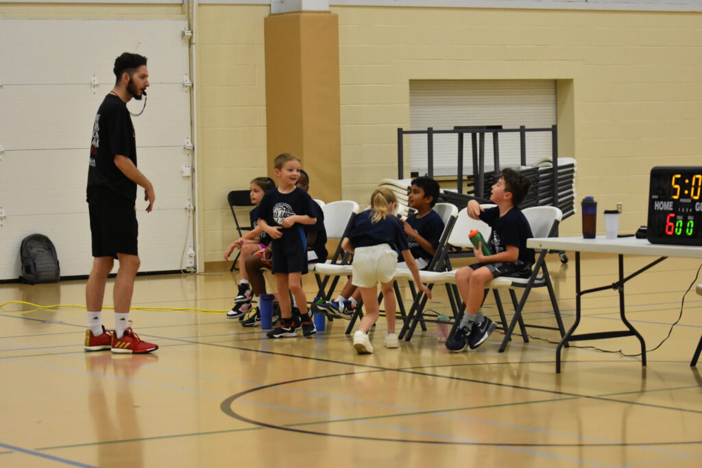 Players sitting and listening to coach