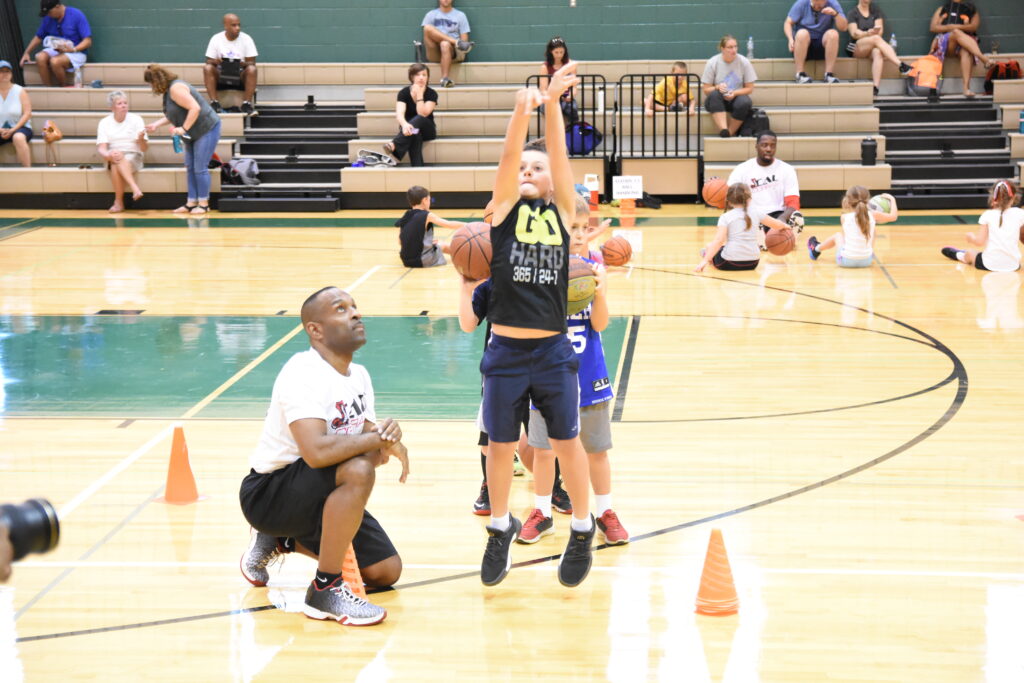 Coach Corey Encouraging Young Athletes